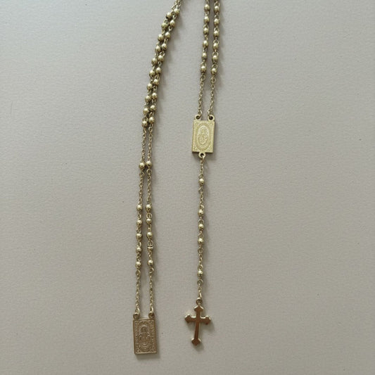 Rosario dorado Protección